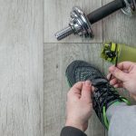 Fitness objects isolated on wooden background. Gray Sneakers, dumbbells and water bottle. Active, healthy lifestyle, sport, fitness, and objects concept. More of my photos and videos Adobe Stock:http://bit.ly/3RqlciK More of my photos and videos Shutterstock: https://www.shutterstock.com/g/ALEKSANDRBERDYUGIN My email: bermix999@gmail.com
